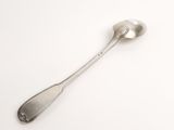 silver spoon on a white surface with a spoon in the middle of it