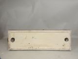 a close up of a metal plate with holes on it