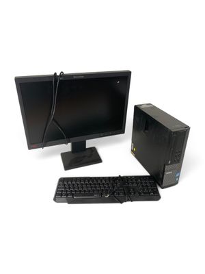 un ordinateur de bureau avec un clavier et une souris sur le bureau
