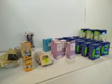 many boxes of toilet paper on a counter in a bathroom