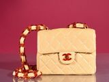 a small white purse with a chain around it