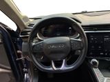 the interior of a car with a steering wheel and dashboard controls