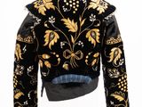 a black jacket with gold and white flowers on it