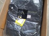 a box of clothing that is sitting on the floor