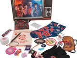 a box with a television, gloves, gloves, and other items