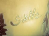 a close up of a vase with a name on it