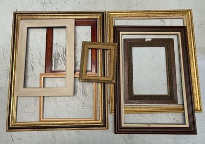 four different colored picture frames on the wall
