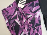 two pairs of leggings with a purple and black design