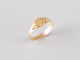 a close up of a gold ring with flowers on it