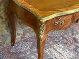 a small table with a drawer on top of it