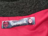red and black jacket with a label on it that says designer