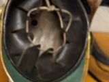a close up of a person ' s hand holding a metal object
