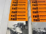 a lot of magazines on a table with a train on it