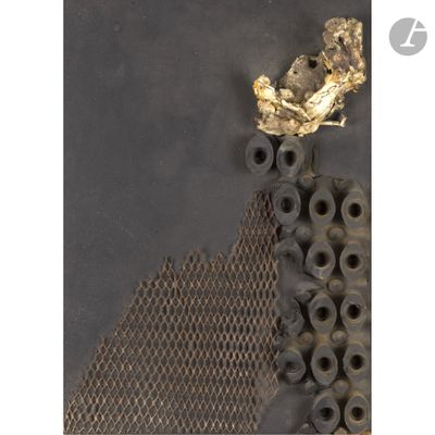 a piece of metal with a gold leaf on top of it