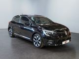 the black toyota corollant is parked in a white room