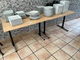 a lot of plates on a table in a restaurant