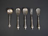 six spoons, forks and spoons are lined up on a black surface