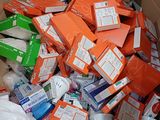 a cardboard box full of toilet paper and other items