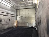 a large room with a wall covered in tarp