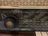 an old fashioned radio sitting on a table in a room