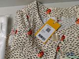 a picture of a dress with a tag on it