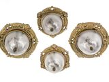 three antique brass wall lights with a white background