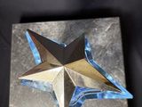 a close up of a metal object with a star on it