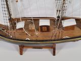 a model of a sailboat on display on a table