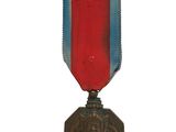 médaille avec un ruban rouge, blanc et bleu sur fond blanc