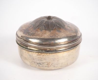 an antique silver plated box with a domed lid on a white background