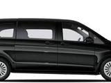 the black van is parked on a white surface