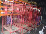 many cages that are on the floor in a warehouse