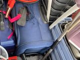 a pile of luggage that is sitting in the back of a truck