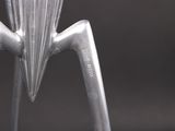 a close up of a juicer with a metal handle