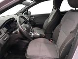 the interior of a car with a steering wheel and a dashboard