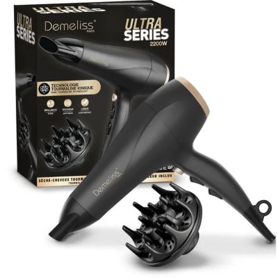 a close up of a hair dryer and a box of hair brushes