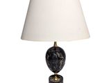 a black marble lamp with a white shade on a white background