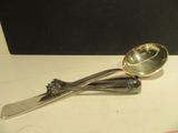 two spoons and a spoon on a table