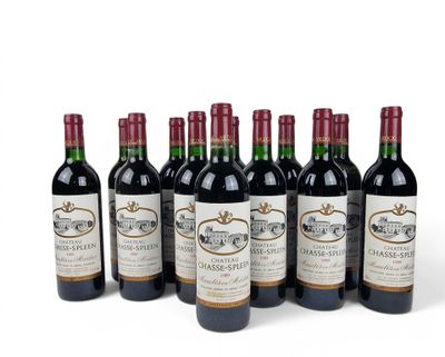 six bottles of wine are lined up in a row on a white surface