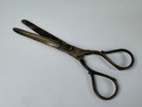 a close up of a pair of scissors on a table