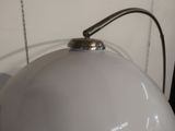 a white lamp that is sitting on a table