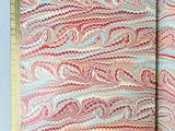 a close up of an open book with a pattern on it
