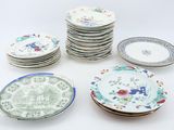 a lot of plates that are sitting on a table