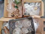 two boxes of glass items sitting on a pallet