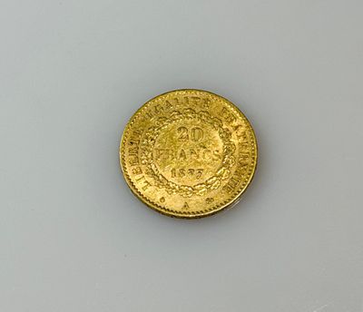 an old gold coin on a white surface with a white background