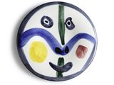 a picture of a plate with a face painted on it
