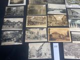 several old black and white photographs of people and buildings on a table