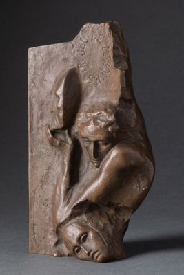 a statue of a woman holding a knife in her hands