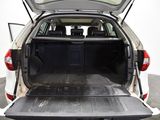 the back end of a white van with the trunk open