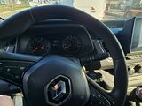 someone is driving a car with a steering wheel and dashboard
